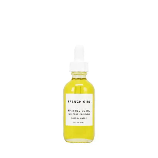 French girl hair revive oil bottle with dropper cap, yellowish-gold liquid inside.