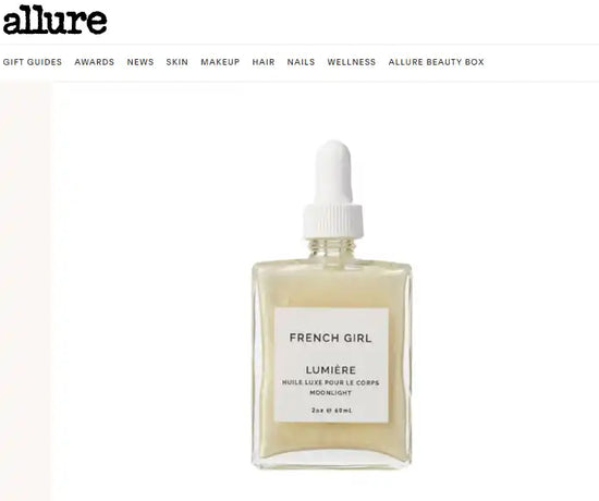 Square bottle of body oil with a dropper.